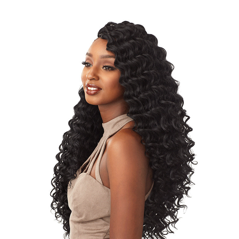 SENSATIONNEL Lulutress deep wave braid hair styled on a woman with long voluminous curls
