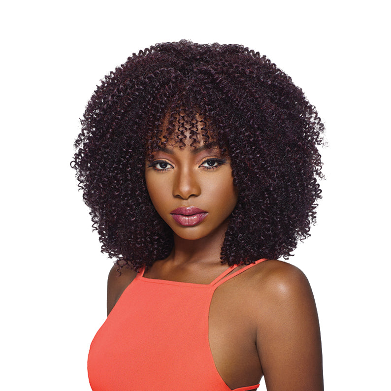OUTRE curly afro braid hairstyle in dark brown worn by woman in orange top