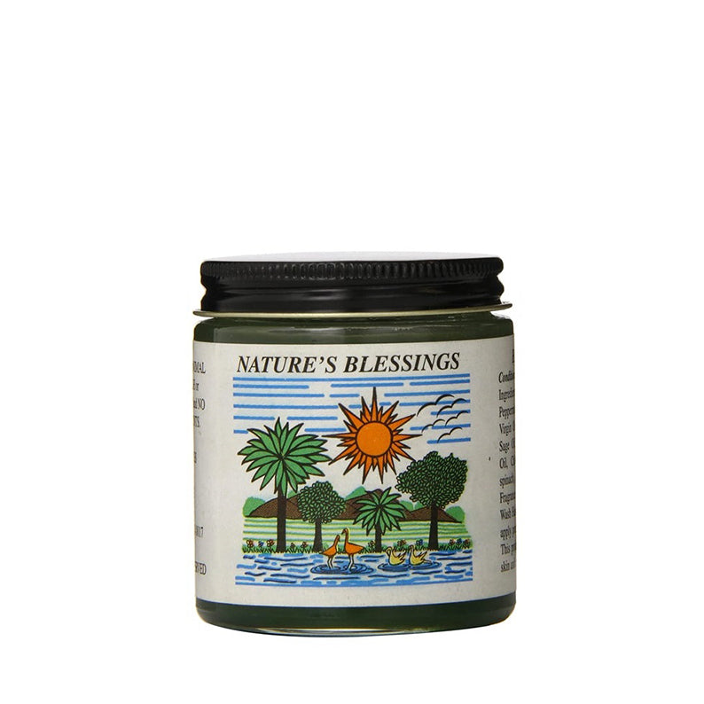 Glass jar of Nature's Blessings hair pomade with black lid and tropical label showing sun palms
