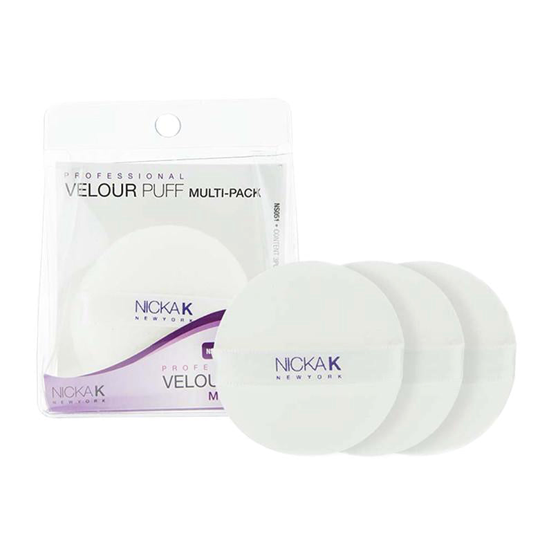 White NICKA K velour makeup sponge multi-pack showing four round velour puffs in clear resealable pouch