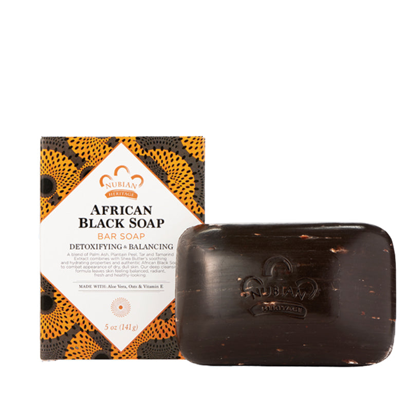Nubian Heritage African Black Soap bar and box displaying detoxifying and balancing formula with natural ingredients