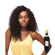 OUTRE curly unprocessed human hair weave shown on model wearing yellow top with hair bundle